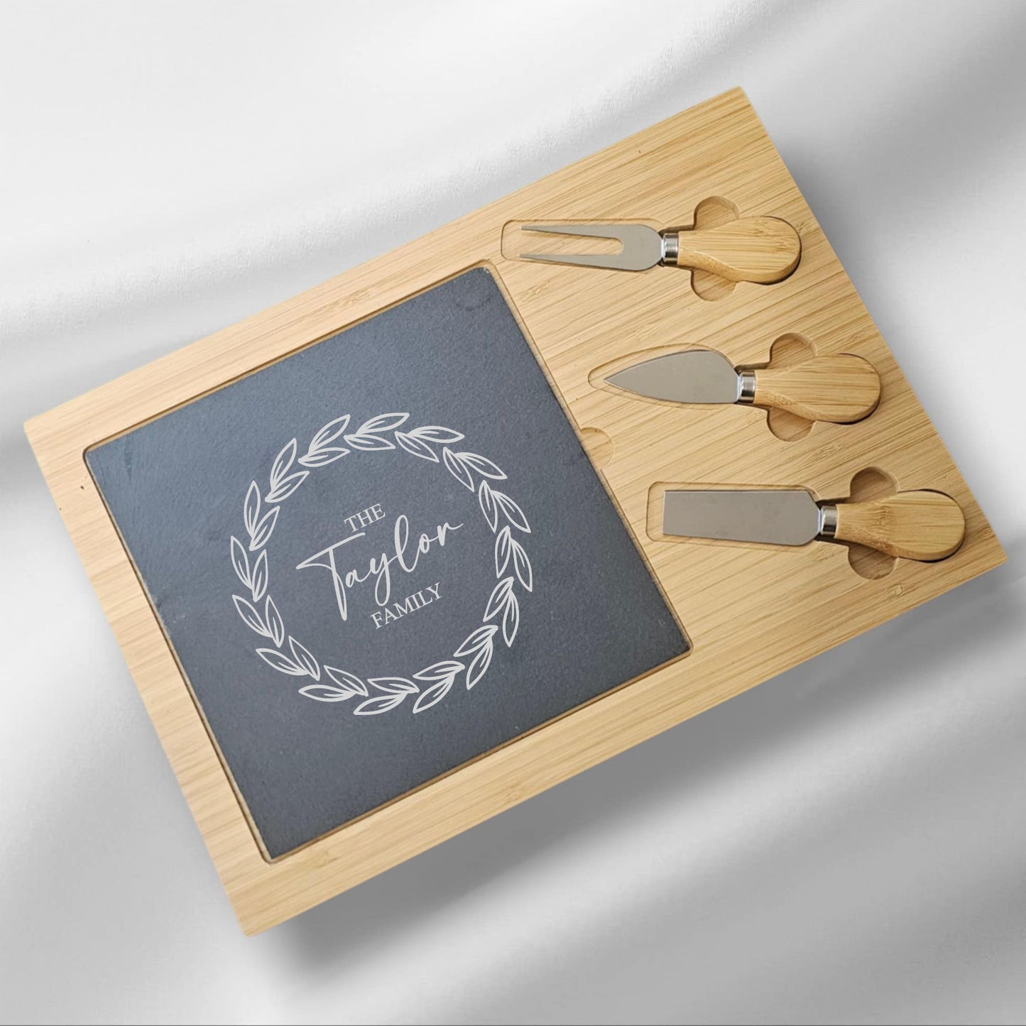 Personalised Bamboo & Slate Cheeseboard Set with Knives – Custom Family Name with Leafy Wreath| Engraved Gift NZ